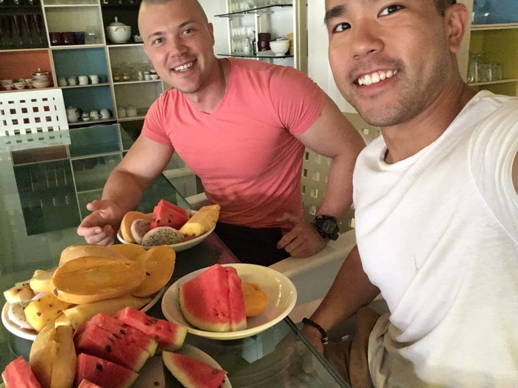 Friends eating pineapple watermelon and fruits in Bangkok Thailand