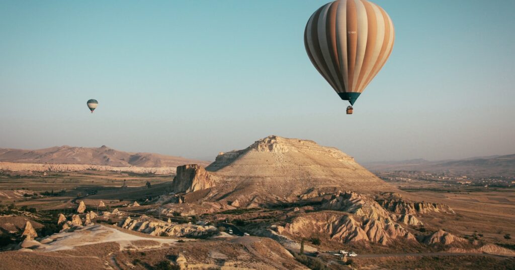 travel by hot air balloon over desert
