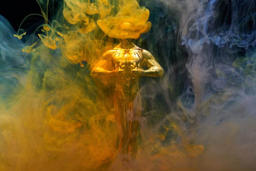 gold trophy of a golden man with plumes of smoke