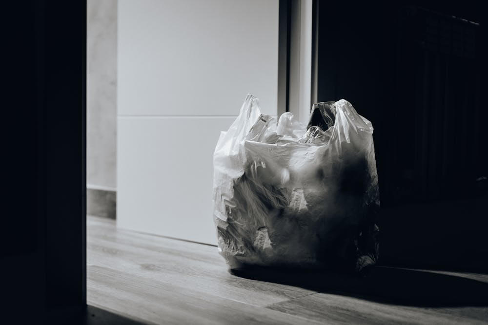 black and white photo of trash bag